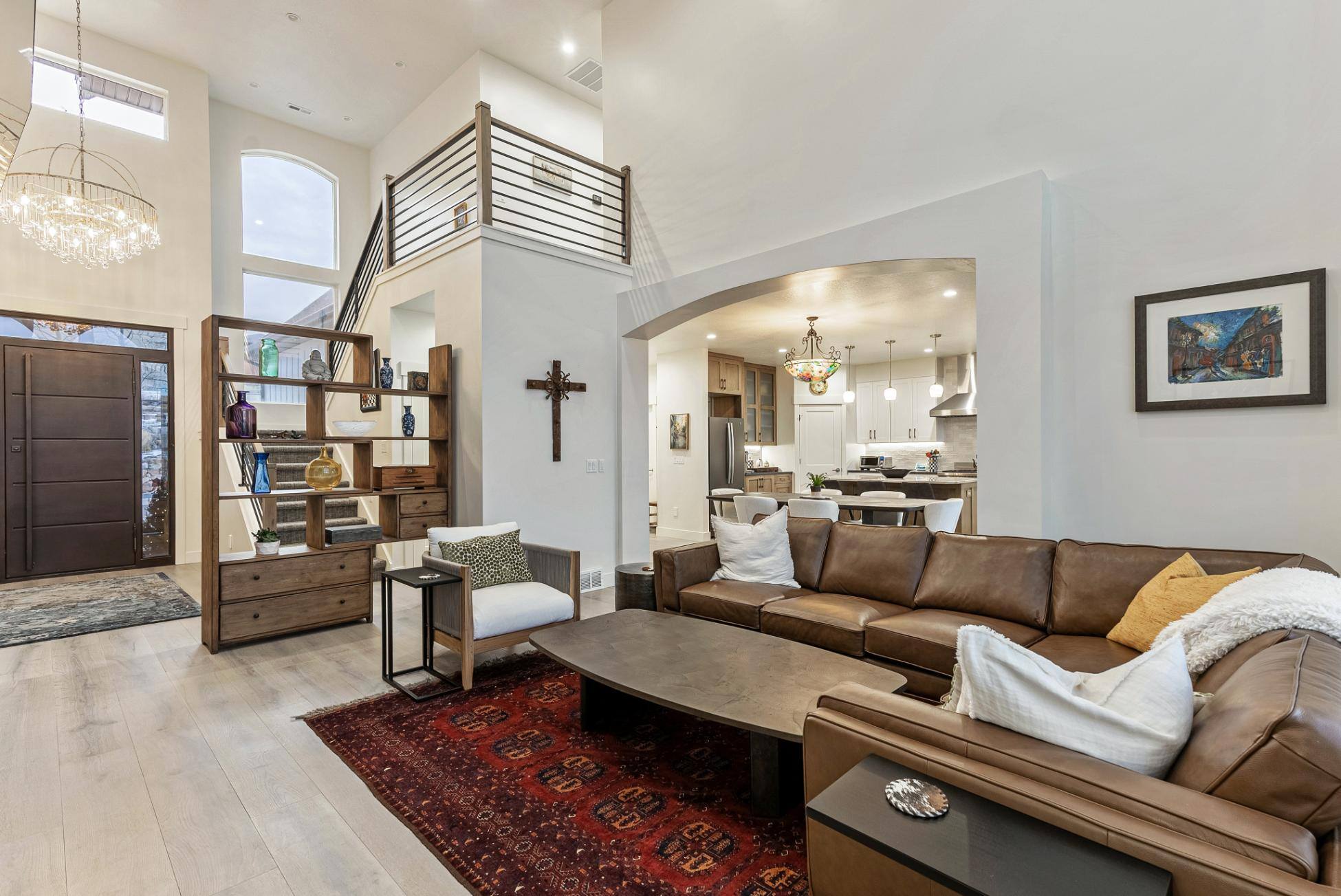 View of Entryway Loft Stairs and Into Kitchen From Living Room of Remodeled Utah Home