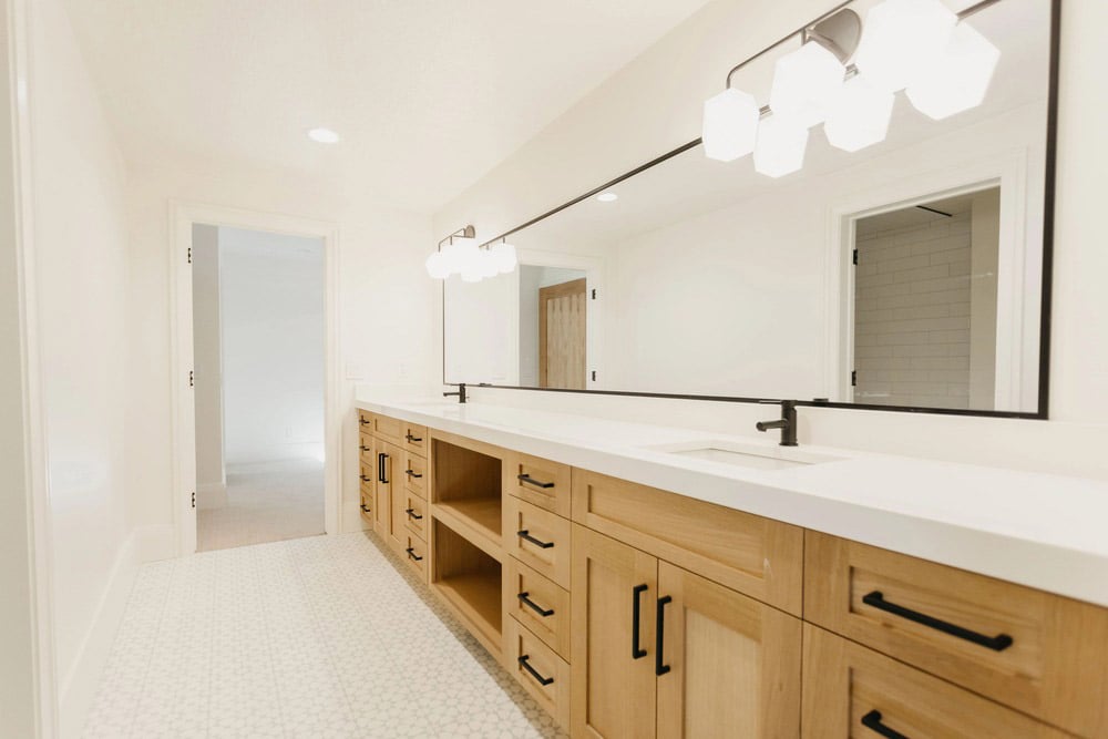 double vanity bathroom sink with wall length mirror by 10x builders in utah county